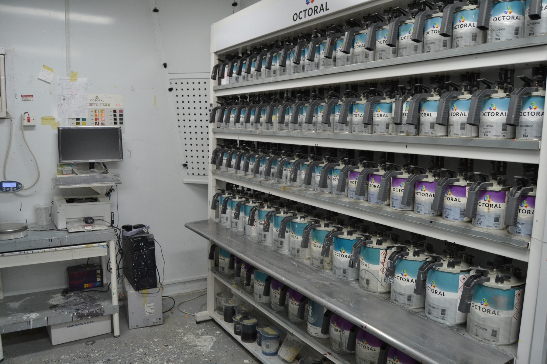 Paint mixing room with automotive color matching materials